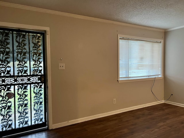 foyer featuring crown molding, dark wood-type flooring, and a textured ceiling