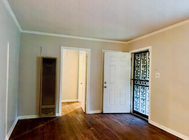 interior space with a textured ceiling, crown molding, and dark wood-type flooring