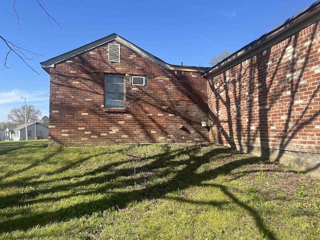 view of property exterior with a lawn