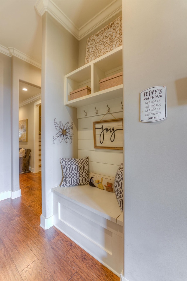 mudroom with hardwood / wood-style floors and ornamental molding