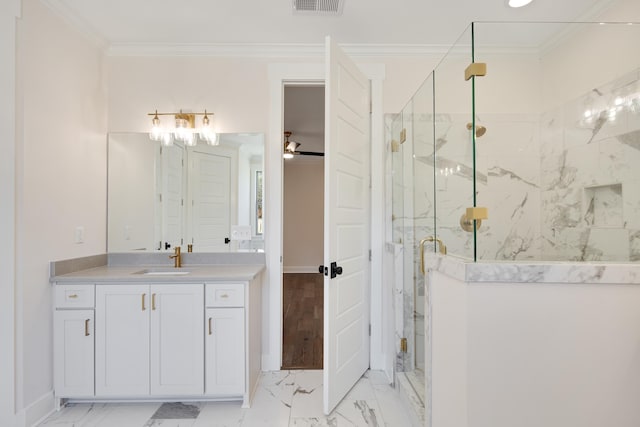 bathroom with walk in shower, ceiling fan, vanity, and ornamental molding