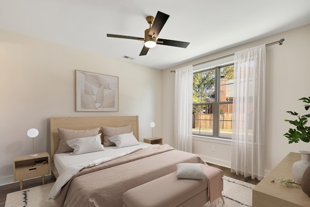 bedroom with ceiling fan and hardwood / wood-style floors