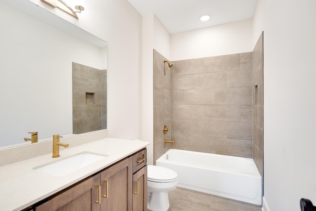 full bathroom with tile patterned floors, tiled shower / bath combo, toilet, and vanity