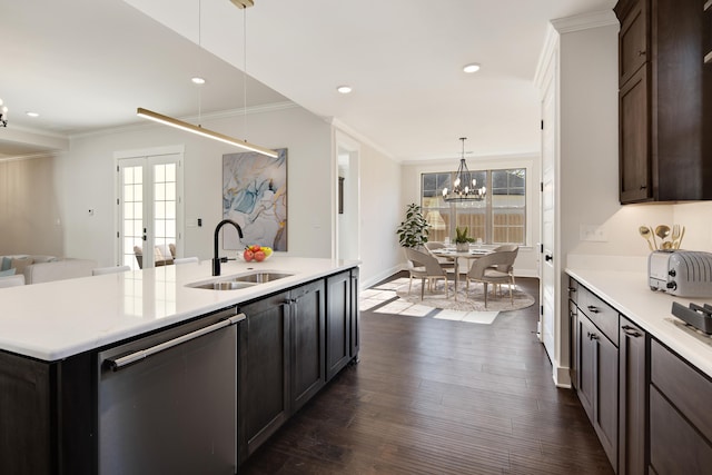 kitchen with a wealth of natural light, dishwasher, a kitchen island with sink, and sink