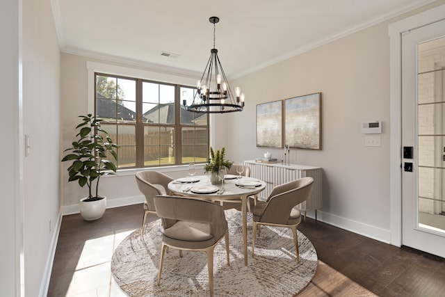 dining room featuring a notable chandelier, dark hardwood / wood-style floors, and ornamental molding