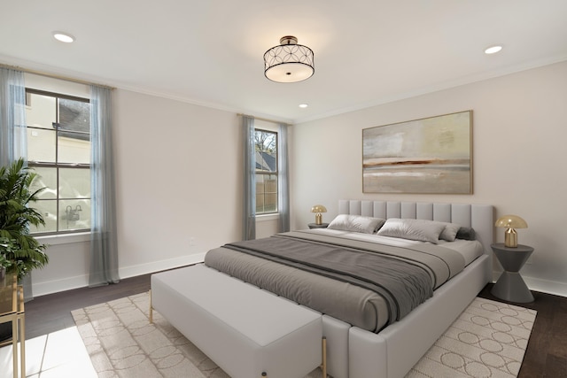 bedroom featuring light hardwood / wood-style flooring and multiple windows