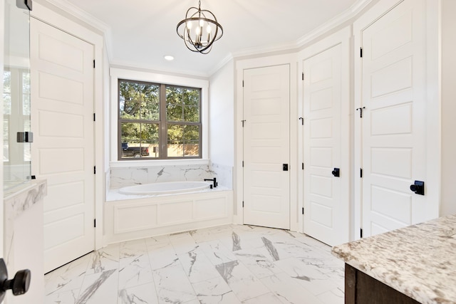 bathroom featuring a washtub, vanity, ornamental molding, and a notable chandelier