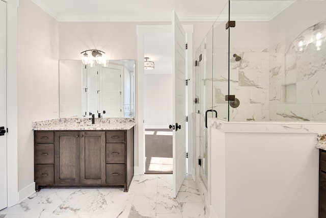 bathroom with a shower with door, vanity, and ornamental molding