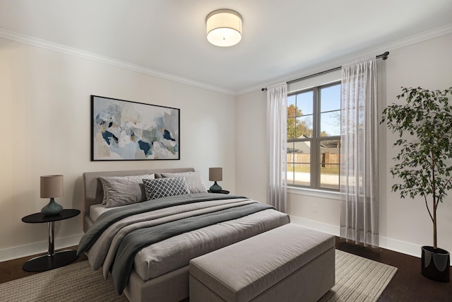 bedroom featuring dark hardwood / wood-style floors and ornamental molding