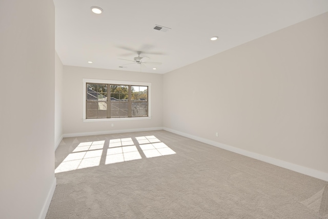 carpeted empty room with ceiling fan