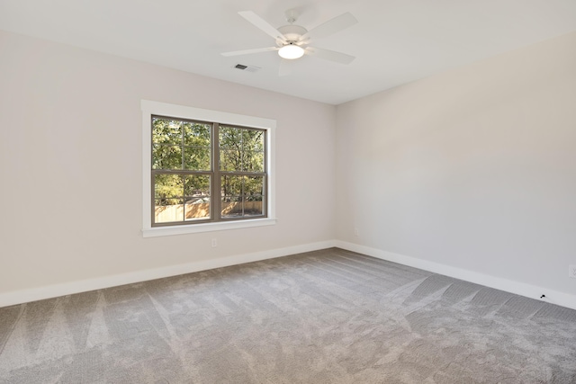 spare room with carpet flooring and ceiling fan