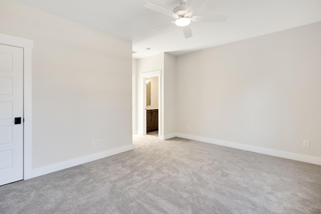 empty room with light carpet and ceiling fan