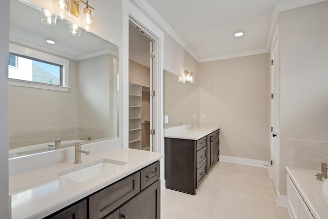 bathroom featuring a bathtub, vanity, and ornamental molding