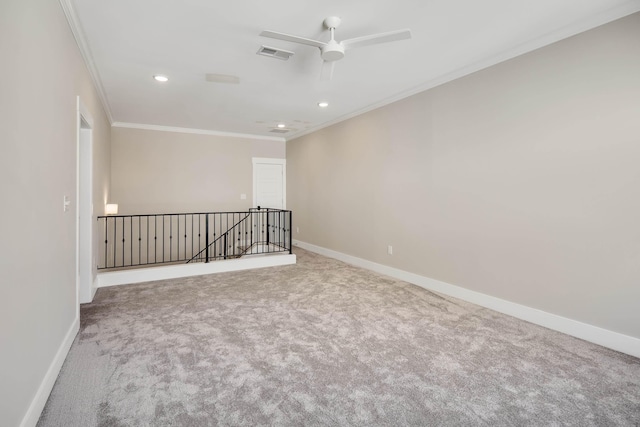 unfurnished room featuring carpet flooring, ceiling fan, and crown molding