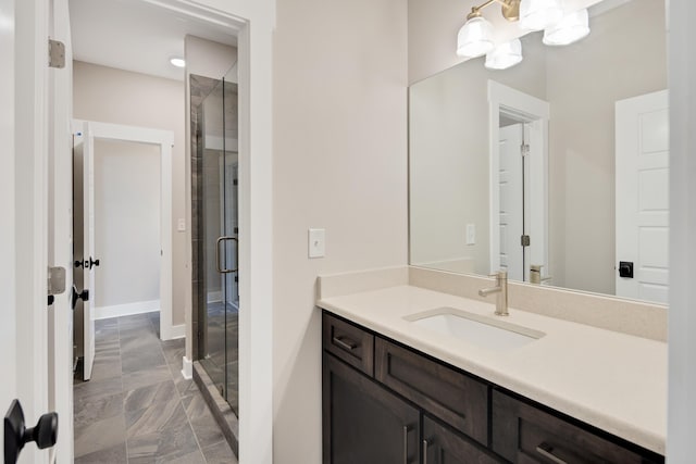 bathroom with a notable chandelier, vanity, and an enclosed shower