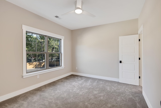 empty room with carpet flooring and ceiling fan