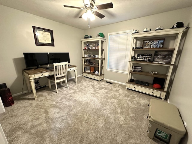 carpeted office with ceiling fan