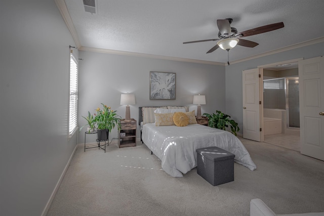 carpeted bedroom featuring a textured ceiling, ensuite bath, ceiling fan, and ornamental molding