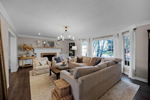 living room featuring a textured ceiling, dark hardwood / wood-style flooring, crown molding, and a chandelier