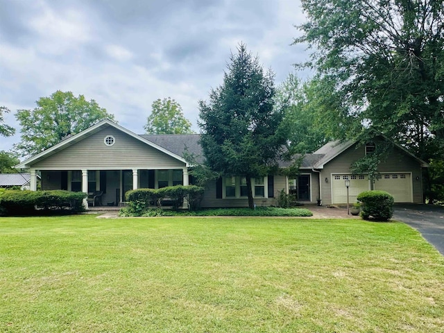 ranch-style house with a porch, a garage, and a front yard