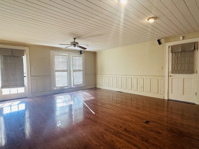 unfurnished room featuring dark hardwood / wood-style floors, ceiling fan, wooden ceiling, and ornamental molding