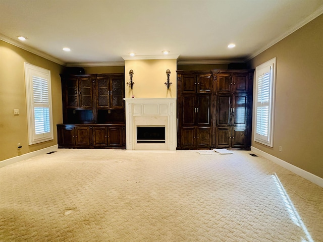 unfurnished living room with light colored carpet and crown molding