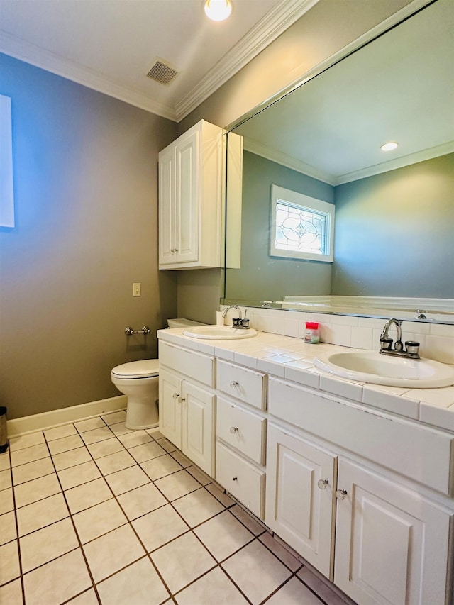 bathroom with tile patterned flooring, vanity, toilet, and ornamental molding