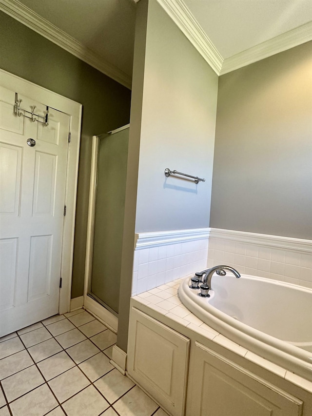 bathroom with tile patterned flooring, shower with separate bathtub, and crown molding