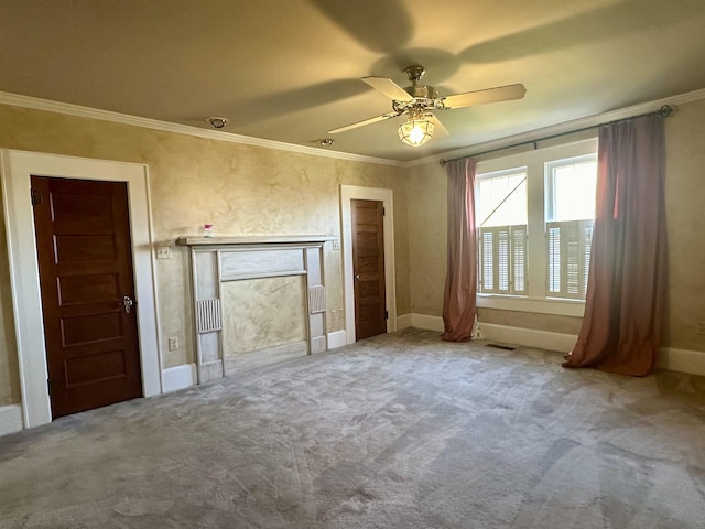 interior space featuring carpet floors, ceiling fan, and crown molding