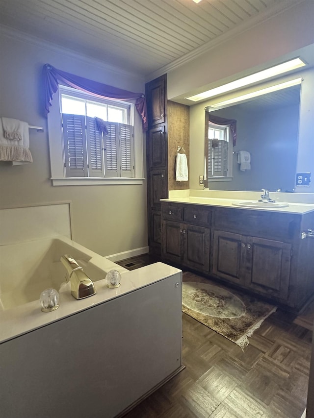 bathroom featuring vanity, ornamental molding, and parquet floors