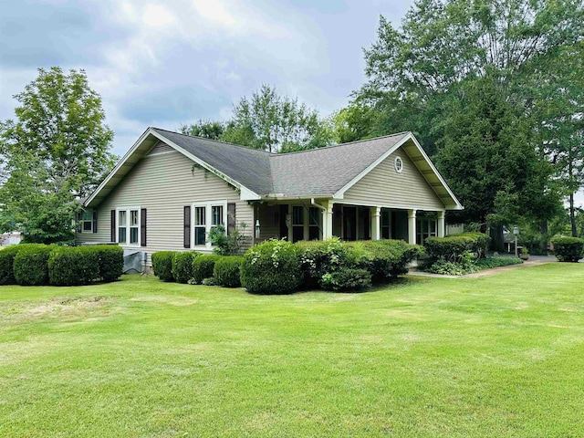 view of property exterior with a yard