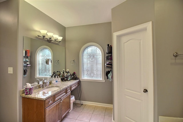 bathroom with tile patterned flooring and vanity