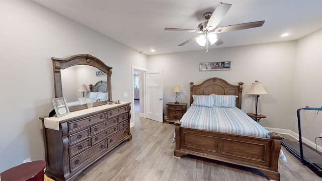 bedroom with ceiling fan and light wood-type flooring