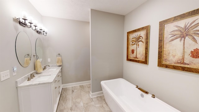 bathroom featuring vanity and a tub to relax in