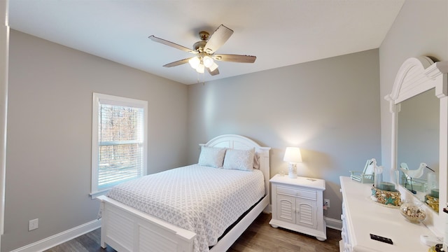 bedroom featuring ceiling fan and dark hardwood / wood-style floors