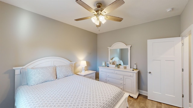 bedroom featuring light hardwood / wood-style flooring and ceiling fan