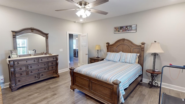 bedroom featuring ceiling fan and light hardwood / wood-style floors