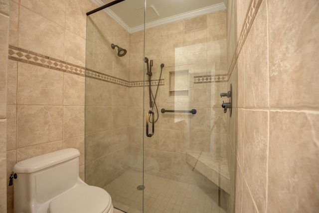 bathroom featuring toilet, a shower with door, ornamental molding, and tile walls