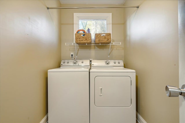 washroom featuring washer and dryer