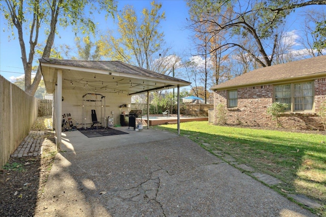 view of patio featuring a grill