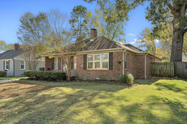 ranch-style home featuring a front yard