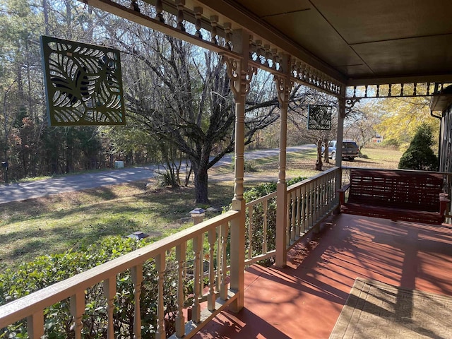 wooden deck featuring covered porch