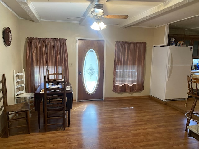 entrance foyer with beam ceiling, ceiling fan, hardwood / wood-style floors, and ornamental molding