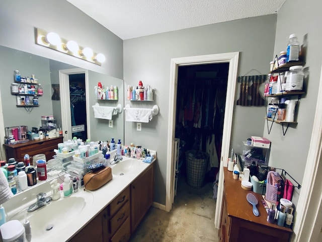 bathroom featuring vanity and a textured ceiling