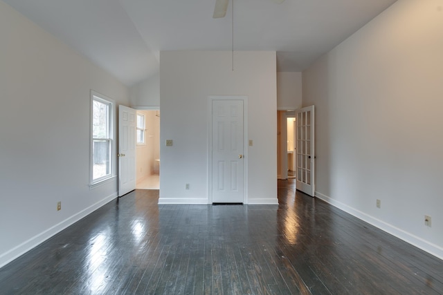 unfurnished room with dark hardwood / wood-style floors, ceiling fan, and lofted ceiling