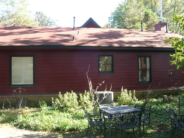 view of property exterior with cooling unit