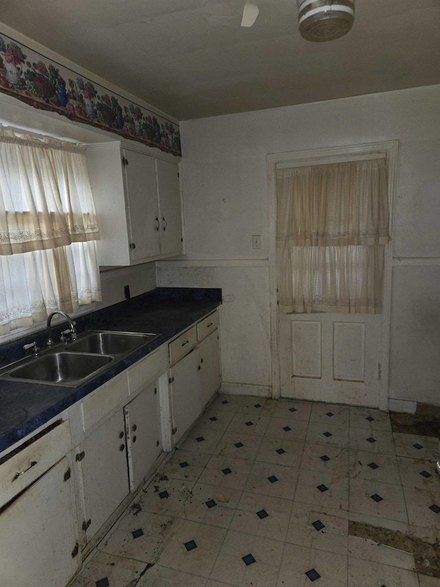 kitchen with white cabinets and sink