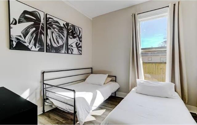 bedroom featuring dark wood-type flooring