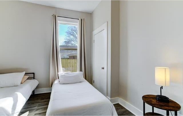 bedroom featuring dark hardwood / wood-style flooring