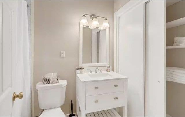 bathroom with vanity and toilet